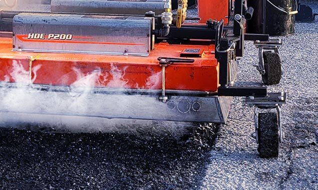Heating asphalt to fix a pothole